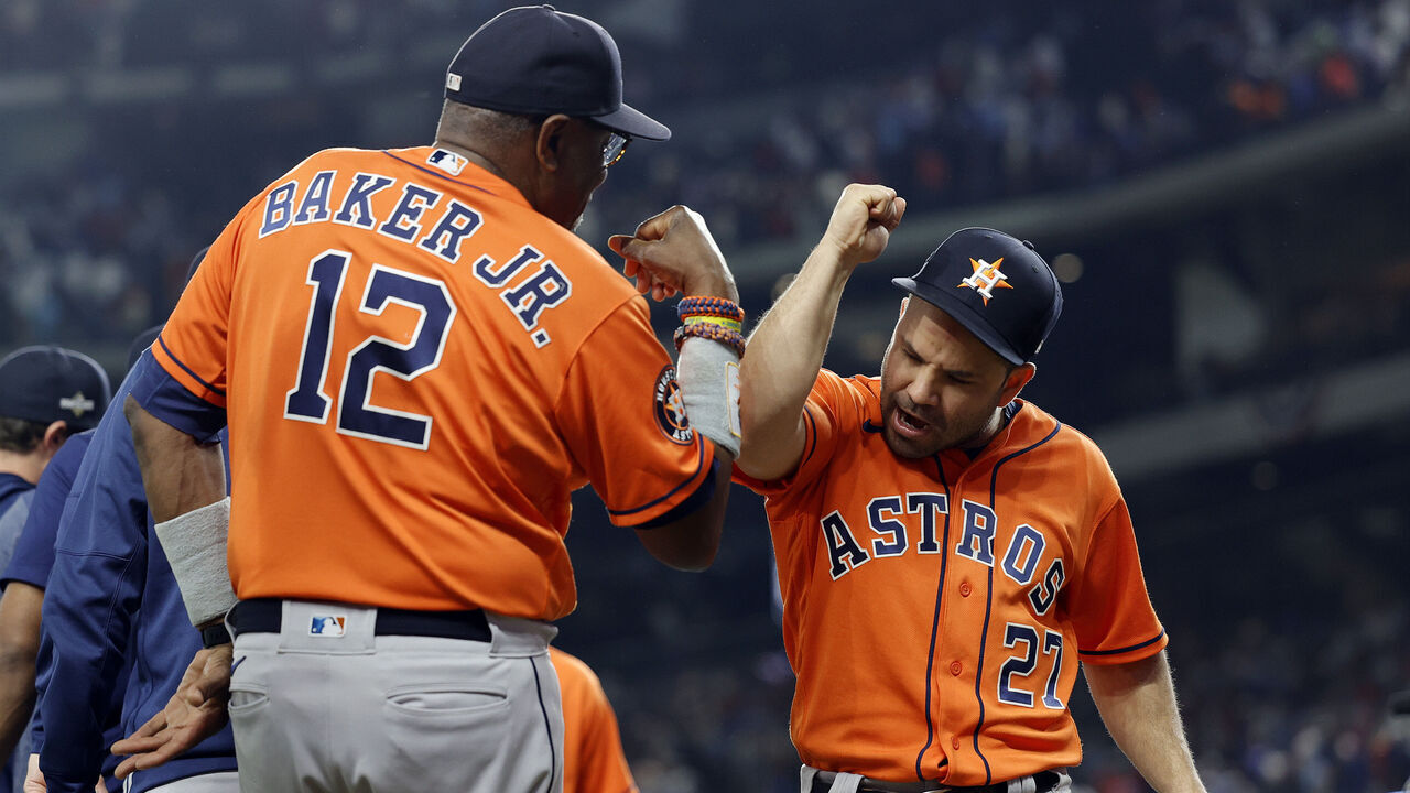 ARLINGTON, TEXAS - OCTOBER 18: Jose Altuve #27 of the Houston Astros celebrates with manager Dusty Baker #12 after defeating the Texas Rangers in Game Three of the American League Championship Series at Globe Life Field on October 18, 2023 in Arlington, Texas.