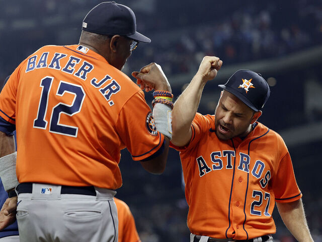 ARLINGTON, TEXAS - OCTOBER 18: Jose Altuve #27 of the Houston Astros celebrates with manager Dusty Baker #12 after defeating the Texas Rangers in Game Three of the American League Championship Series at Globe Life Field on October 18, 2023 in Arlington, Texas.