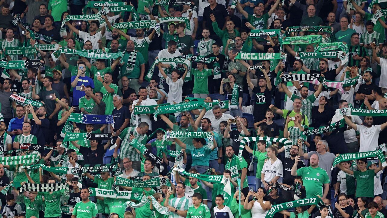 Supporters cheer ahead of the UEFA Europa League Group F football match between Israel's Maccabi Haifa and Greece's Panathinaikos at the Sammy Ofer Stadium in Haifa on October 5, 2023.