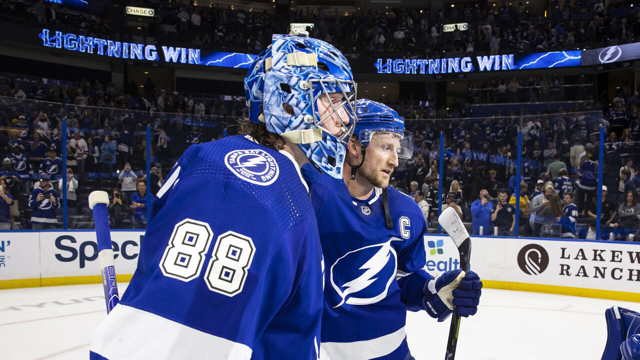 TAMPA, FL - NOVEMBER 25: Goalie Andrei Vasilevskiy #88 and Steven Stamkos #91 of the Tampa Bay Lightning celebrates the win against the St Louis Blues at Amalie Arena on November 25, 2022 in Tampa, Florida.