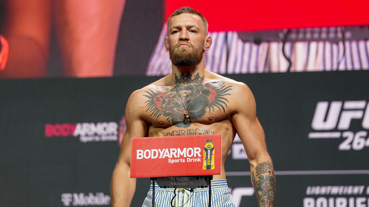 LAS VEGAS, NV - JULY 09: Conor McGregor steps on the scale in front of a packed house at the UFC 264 ceremonial weigh-in at T-Mobile Arena on July 9, 2021 in Las Vegas, NV, United States.