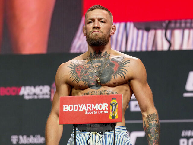 LAS VEGAS, NV - JULY 09: Conor McGregor steps on the scale in front of a packed house at the UFC 264 ceremonial weigh-in at T-Mobile Arena on July 9, 2021 in Las Vegas, NV, United States.