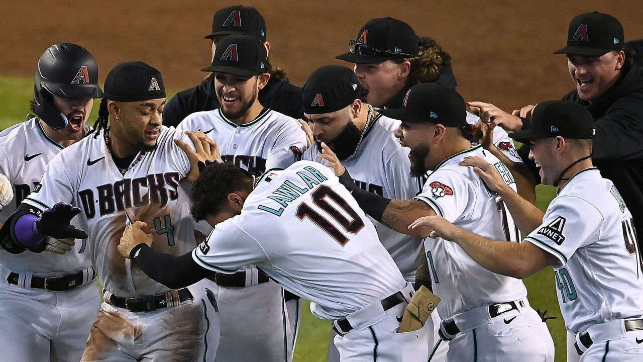 PHOENIX, ARIZONA - OCTOBER 19: Ketel Marte #4 of the Arizona Diamondbacks celebrates with his teammates after hitting an RBI single against Craig Kimbrel #31 of the Philadelphia Phillies to win Game Three of the National League Championship Series at Chase Field on October 19, 2023 in Phoenix, Arizona.