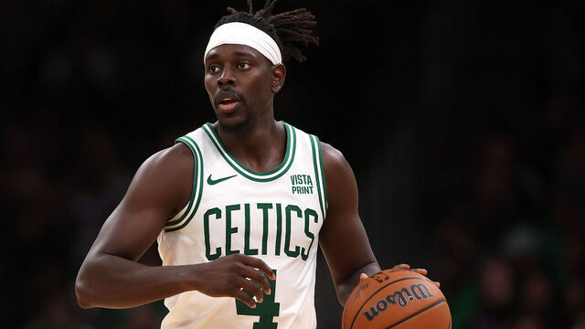 BOSTON, MASSACHUSETTS - OCTOBER 17: Jrue Holiday #4 of the Boston Celtics dribbles during the second half of the Celtic's preseason game against the New York Knicks at TD Garden on October 17, 2023 in Boston, Massachusetts.