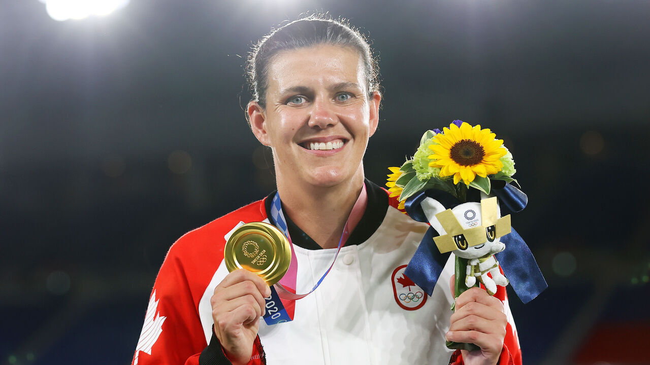 YOKOHAMA, JAPAN - AUGUST 06: Gold medalist Christine Sinclair of Team Canada poses with their gold medal during the Women's Football Competition Medal Ceremony on day fourteen of the Tokyo 2020 Olympic Games at International Stadium Yokohama on August 06, 2021 in Yokohama, Kanagawa, Japan.