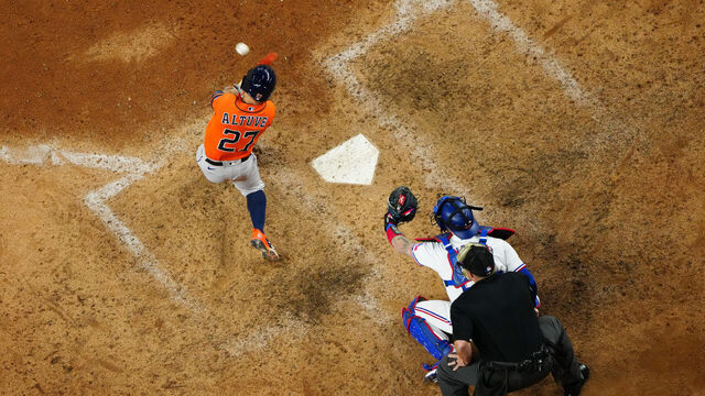 ARLINGTON, TX - OCTOBER 20: Jose Altuve #27 of the Houston Astros hits a three-run home run to retake the lead in the ninth inning during Game 5 of the ALCS between the Houston Astros and the Texas Rangers at Globe Life Field on Friday, October 20, 2023 in Arlington, Texas.