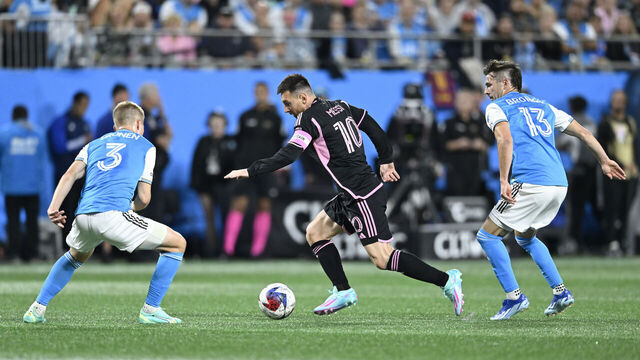 CHARLOTTE, NORTH CAROLINA - OCTOBER 21: Lionel Messi #10 of Inter Miami controls the ball while defended by Jere Uronen #3 and Brandt Bronico #13 of Charlotte FC during the first half at Bank of America Stadium on October 21, 2023 in Charlotte, North Carolina.