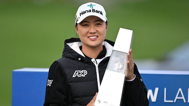 Australia's Minjee Lee poses with the trophy after her victory at the BMW Ladies Championship golf tournament at Seowon Hills Country Club in Paju on October 22, 2023.