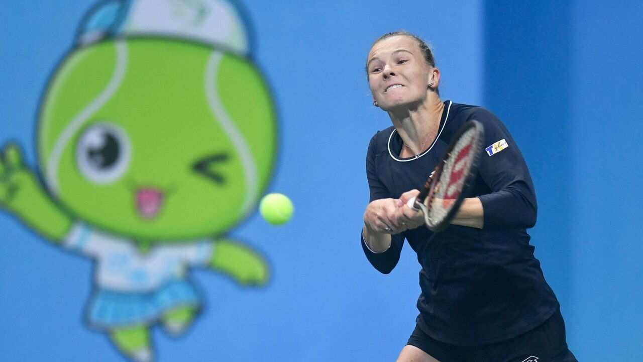 Czech Republic's Katerina Siniakova hits a return to Canada's Leylah Fernandez during their women's singles semi-final match at the WTA Jiangxi Open tennis tournament in Nanchang, in China's central Jiangxi province on October 21, 2023.