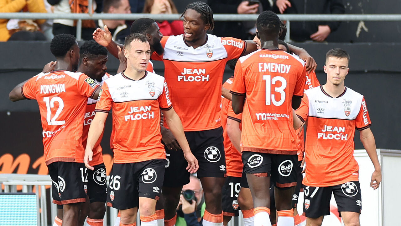Lorient's players celebrate after scoring a goal during the French L1 football match between FC Lorient and Stade Rennais FC at the Moustoir stadium in Lorient, western France, on October 22, 2023.