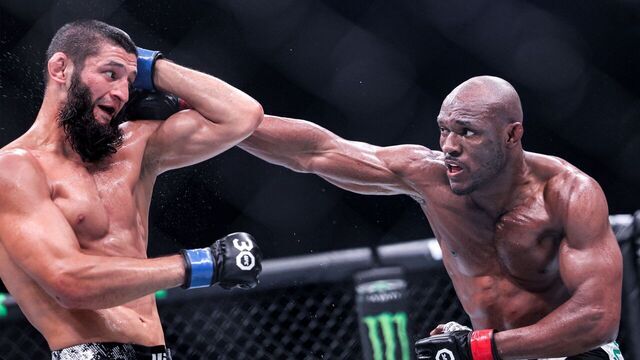 Russia's Khamzat Chimaev (black) and Nigeria's Kamaru Usman (white) compete in their Middleweight bout during the Ultimate Fighting Championship 294 (UFC) event at the Etihad Arena in Abu Dhabi on October 21, 2023.