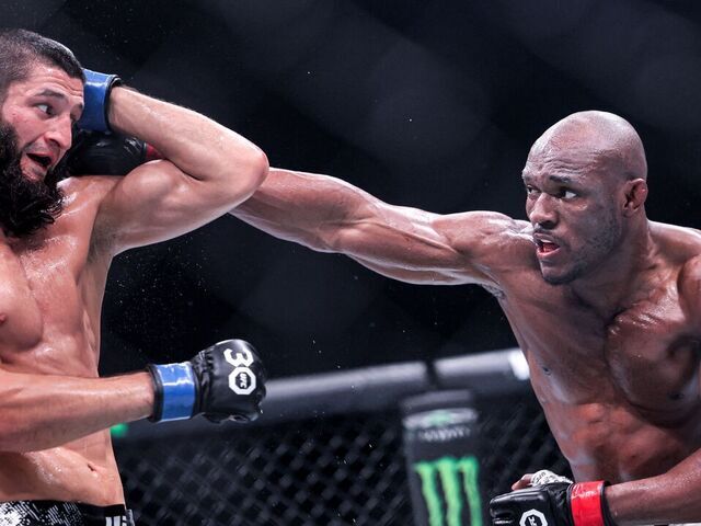 Russia's Khamzat Chimaev (black) and Nigeria's Kamaru Usman (white) compete in their Middleweight bout during the Ultimate Fighting Championship 294 (UFC) event at the Etihad Arena in Abu Dhabi on October 21, 2023.