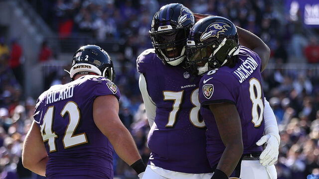 BALTIMORE, MARYLAND - OCTOBER 22: Lamar Jackson #8 of the Baltimore Ravens celebrates with Morgan Moses #78 after scoring a rushing touchdown in the first quarter of the game against the Detroit Lions at M&T Bank Stadium on October 22, 2023 in Baltimore, Maryland.