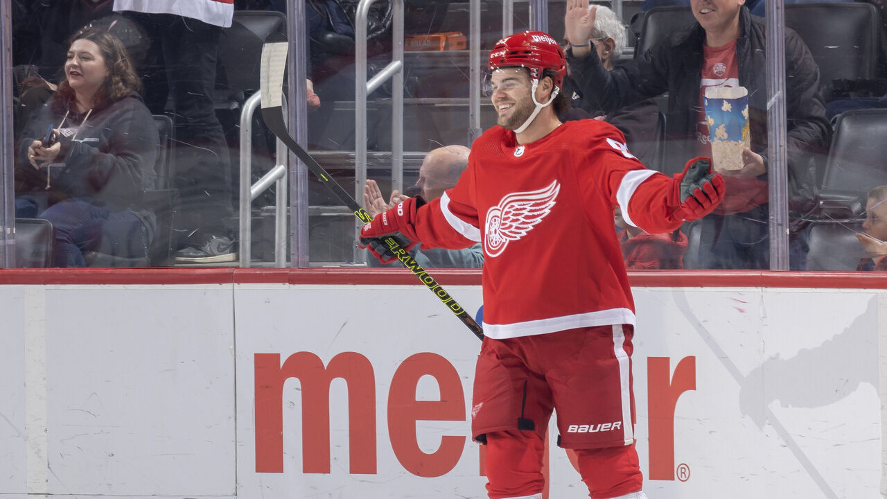 DETROIT, MI - OCTOBER 22: Alex DeBrincat #93 of the Detroit Red Wings celebrates a goal against the Calgary Flames during the first period at Little Caesars Arena on October 22, 2023 in Detroit, Michigan.