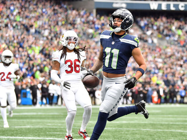 SEATTLE, WASHINGTON - OCTOBER 22: Jaxon Smith-Njigba #11 of the Seattle Seahawks scores a touchdown in the first quarter of the game against the Arizona Cardinals at Lumen Field on October 22, 2023 in Seattle, Washington.