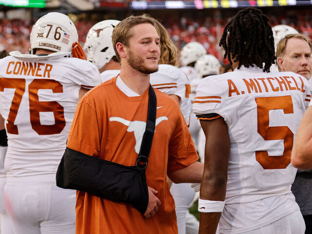 HOUSTON, TEXAS - OCTOBER 21: Quinn Ewers #3 of the Texas Longhorns wears a sling while congratulating Adonai Mitchell #5 after a touchdown in the second half against the Houston Cougars at TDECU Stadium on October 21, 2023 in Houston, Texas.