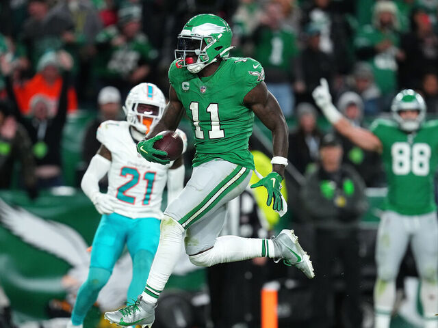PHILADELPHIA, PENNSYLVANIA - OCTOBER 22: A.J. Brown #11 of the Philadelphia Eagles scores a touchdown on a pass play during the second half of a game against the Miami Dolphins at Lincoln Financial Field on October 22, 2023 in Philadelphia, Pennsylvania.