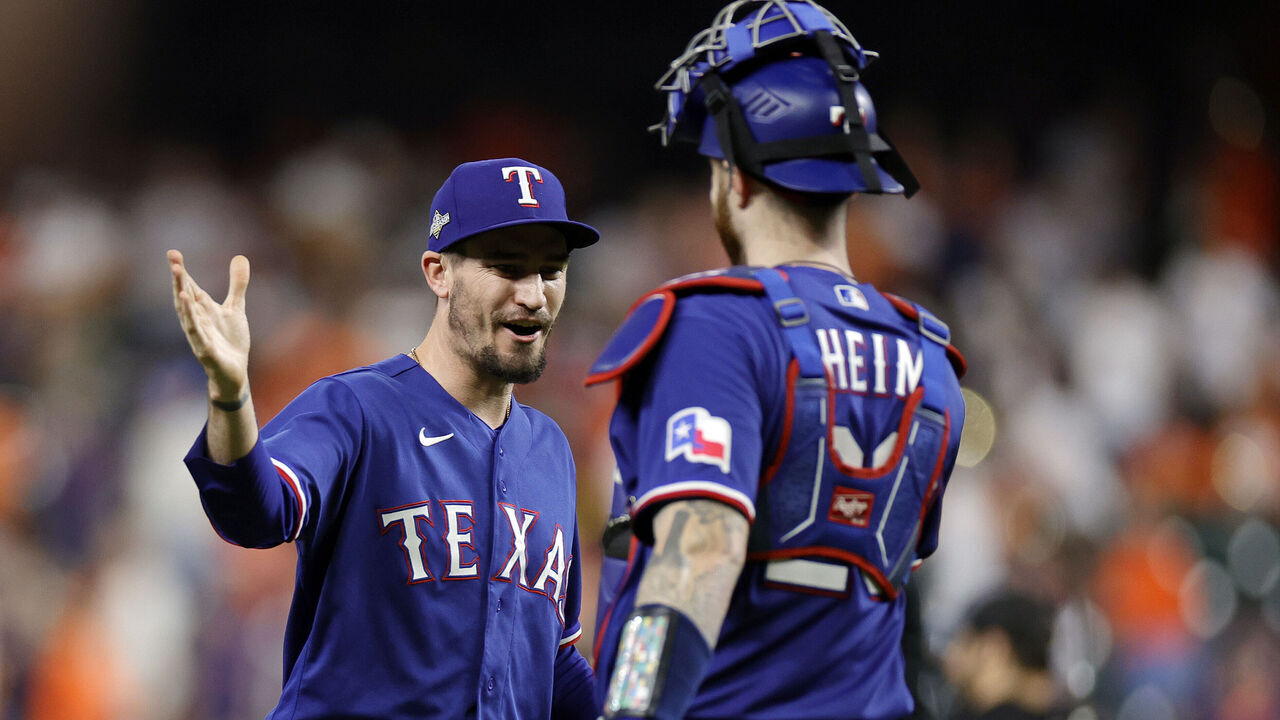 HOUSTON, TEXAS - OCTOBER 22: Andrew Heaney #44 and Jonah Heim #28 of the Texas Rangers celebrates after defeating the Houston Astros in Game Six of the American League Championship Series at Minute Maid Park on October 22, 2023 in Houston, Texas.