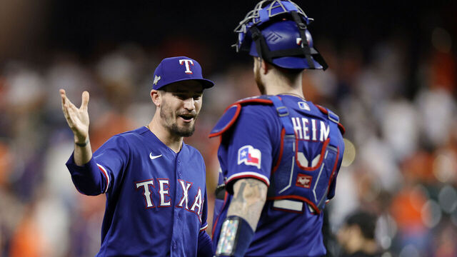 HOUSTON, TEXAS - OCTOBER 22: Andrew Heaney #44 and Jonah Heim #28 of the Texas Rangers celebrates after defeating the Houston Astros in Game Six of the American League Championship Series at Minute Maid Park on October 22, 2023 in Houston, Texas.
