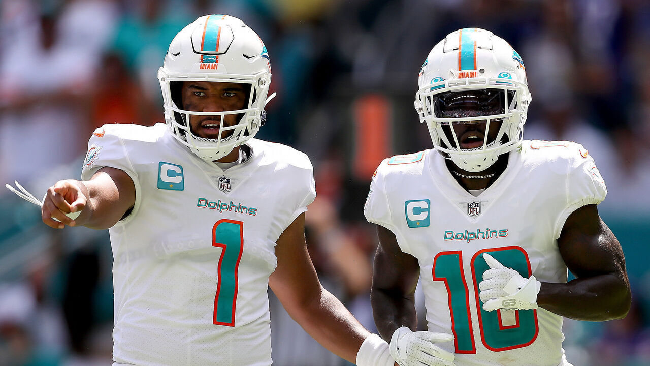 MIAMI GARDENS, FLORIDA - SEPTEMBER 25: Tua Tagovailoa #1 and Tyreek Hill #10 of the Miami Dolphins in action during the first half of the game against the Buffalo Bills at Hard Rock Stadium on September 25, 2022 in Miami Gardens, Florida.