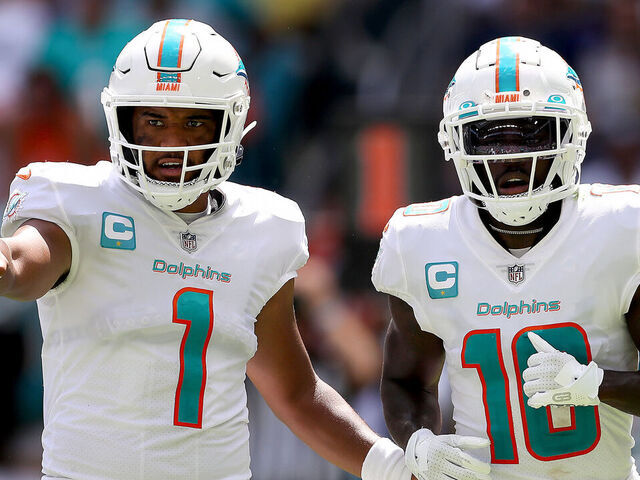 MIAMI GARDENS, FLORIDA - SEPTEMBER 25: Tua Tagovailoa #1 and Tyreek Hill #10 of the Miami Dolphins in action during the first half of the game against the Buffalo Bills at Hard Rock Stadium on September 25, 2022 in Miami Gardens, Florida.