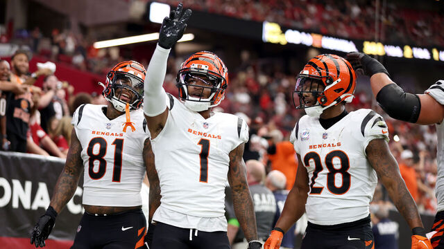 GLENDALE, ARIZONA - OCTOBER 08: Ja'Marr Chase #1 of the Cincinnati Bengals celebrates a touchdown with teammates Joe Mixon #28 and Irv Smith Jr. #81 against the Arizona Cardinals during the first quarter at State Farm Stadium on October 08, 2023 in Glendale, Arizona.