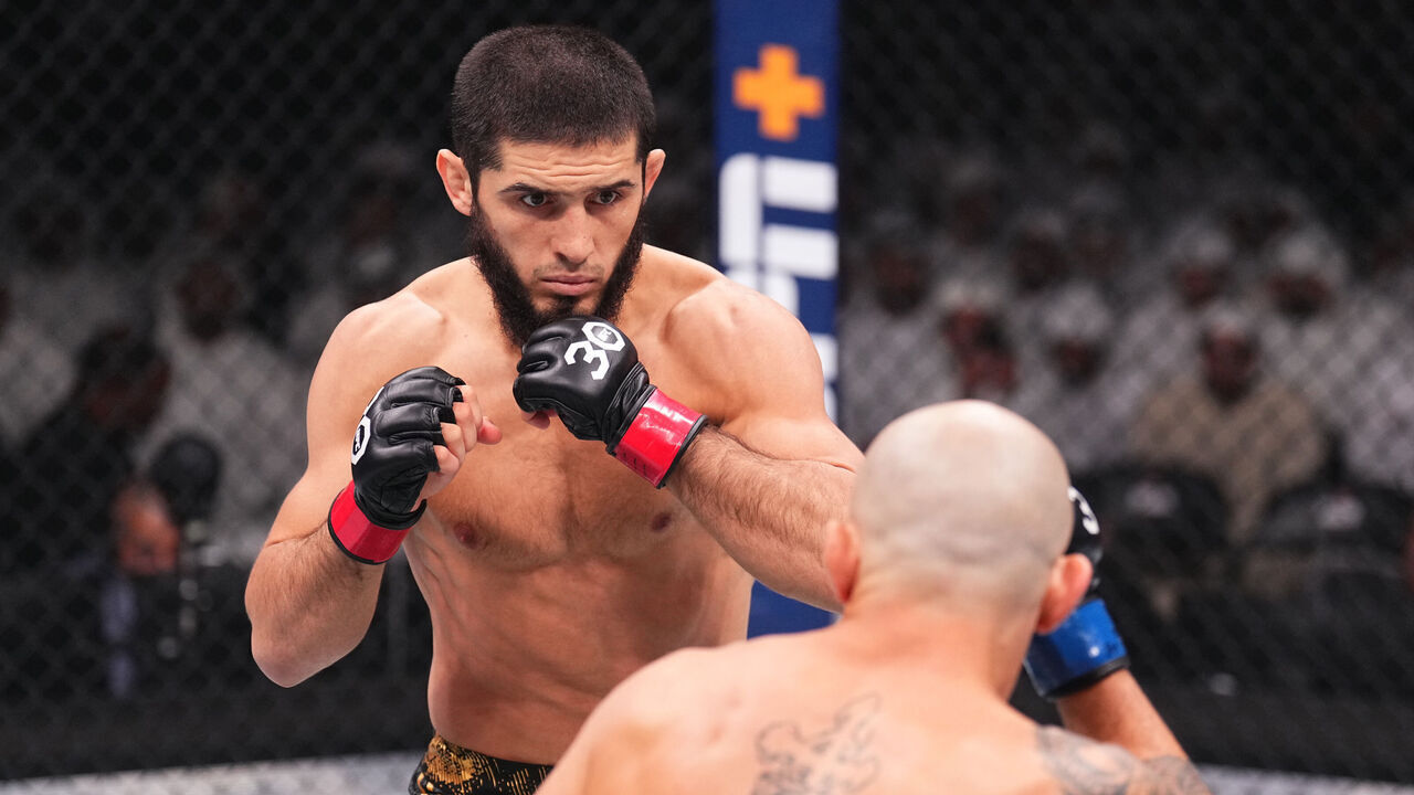 ABU DHABI, UNITED ARAB EMIRATES - OCTOBER 21: (L-R) Islam Makhachev of Russia battles Alexander Volkanovski of Australia in the UFC lightweight championship fight during the UFC 294 event at Etihad Arena on October 21, 2023 in Abu Dhabi, United Arab Emirates.