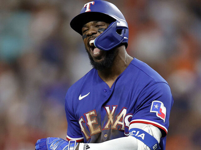 Adolis Garcia of the Texas Rangers celebrates after hitting a solo News  Photo - Getty Images