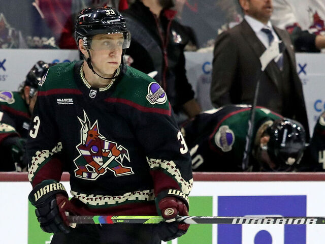 TEMPE, ARIZONA - OCTOBER 21: Travis Dermott #33 of the Arizona Coyotes skates on the ice with pride tape at Mullett Arena on October 21, 2023 in Tempe, Arizona.