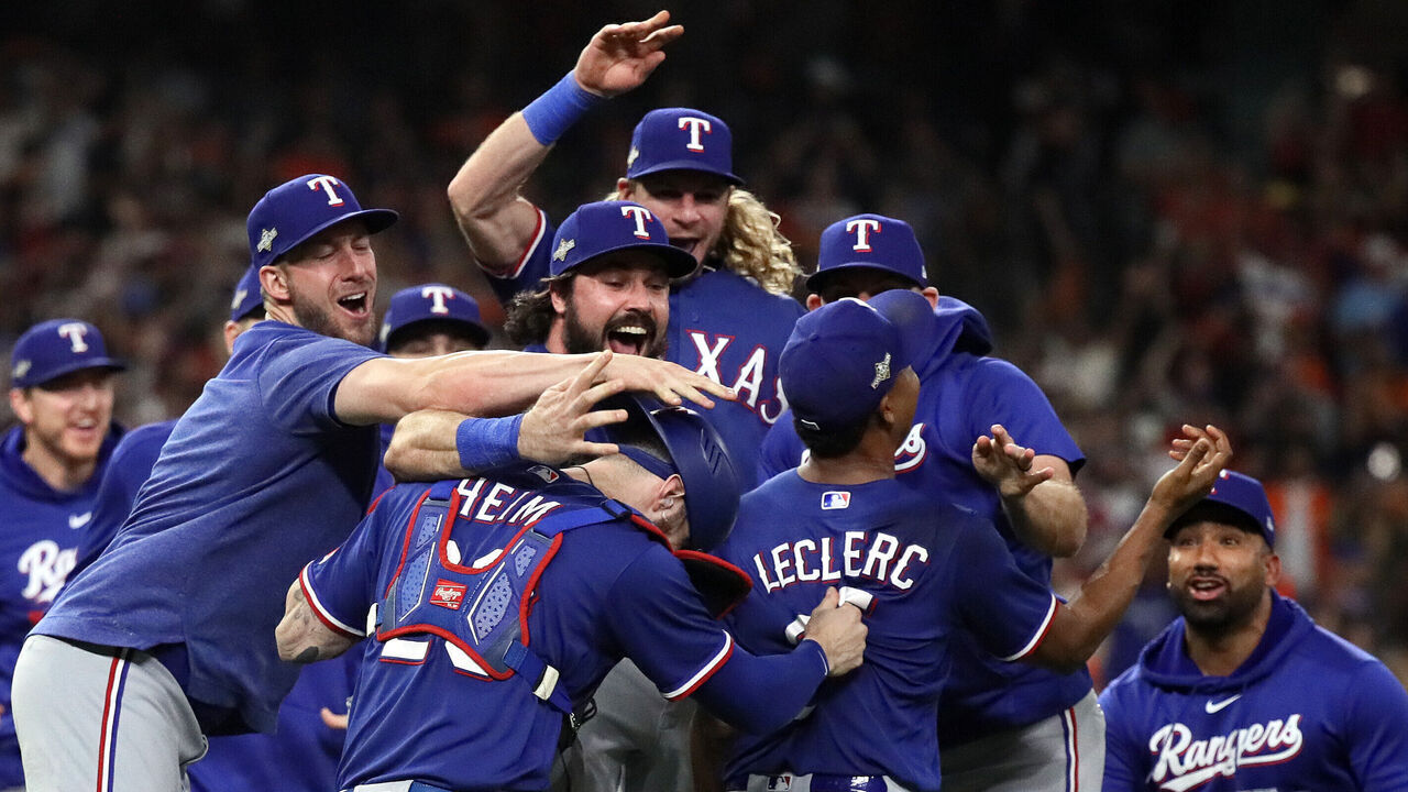 HOUSTON, TEXAS - OCTOBER 23: Jose Leclerc #25 of the Texas Rangers celebrates with Jonah Heim #28 after defeating the Houston Astros in Game Seven to win the American League Championship Series at Minute Maid Park on October 23, 2023 in Houston, Texas.