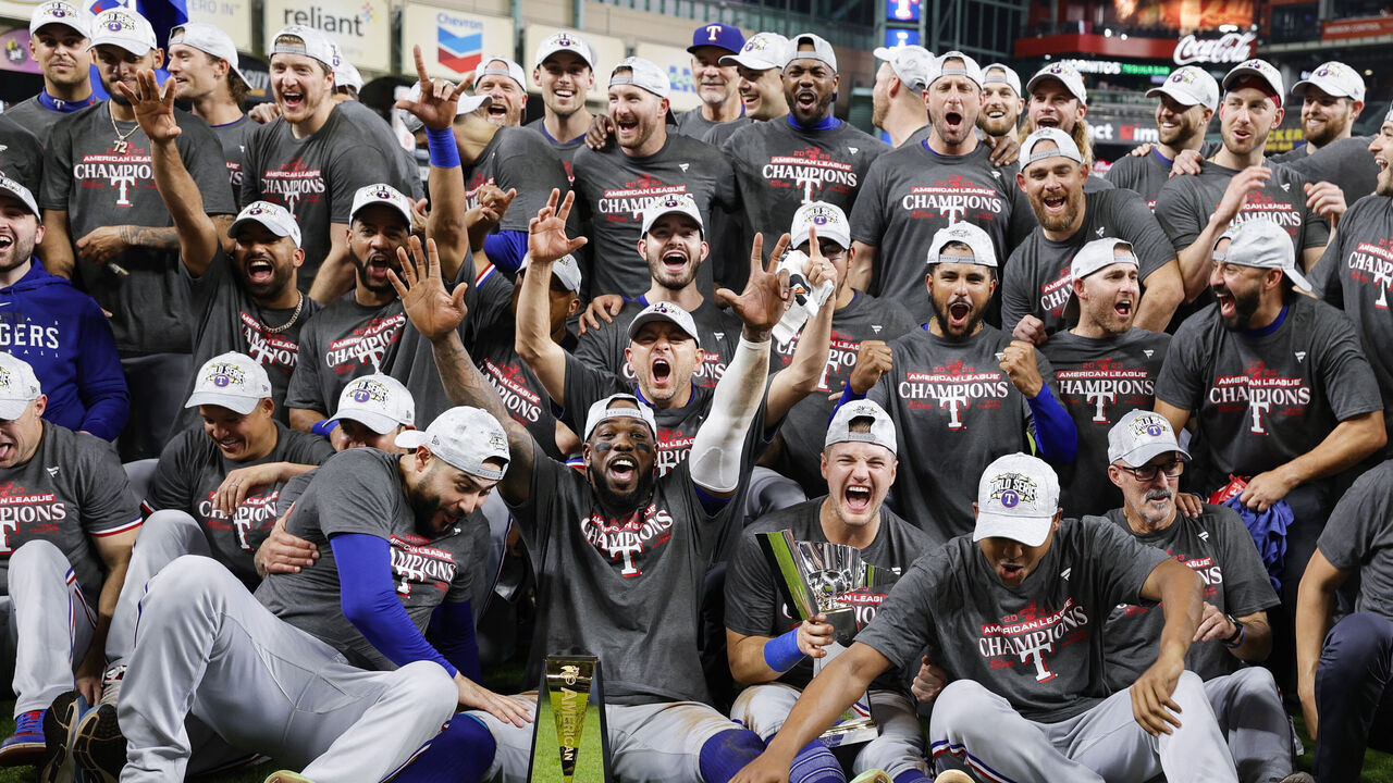 HOUSTON, TEXAS - OCTOBER 23: Members of the Texas Rangers pose for a photo after Game 7 of the ALCS between the Texas Rangers and the Houston Astros at Minute Maid Park on Monday, October 23, 2023 in Houston, Texas.