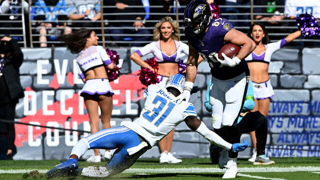 BALTIMORE, MARYLAND - OCTOBER 22: Mark Andrews #89 of the Baltimore Ravens is tackled by Kerby Joseph #31 of the Detroit Lions at M&T Bank Stadium on October 22, 2023 in Baltimore, Maryland.