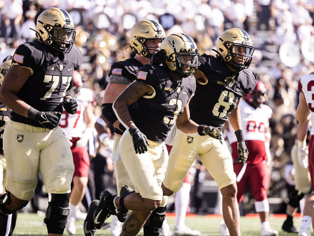 WEST POINT, NEW YORK - OCTOBER 15: Ay'Jaun Marshall #3 of the Army Black Knights celebrates with Braheam Murphy #8 after scoring a touchdown during the first half of the game against the Colgate Raiders at Michie Stadium on October 15, 2022 in West Point, New York.