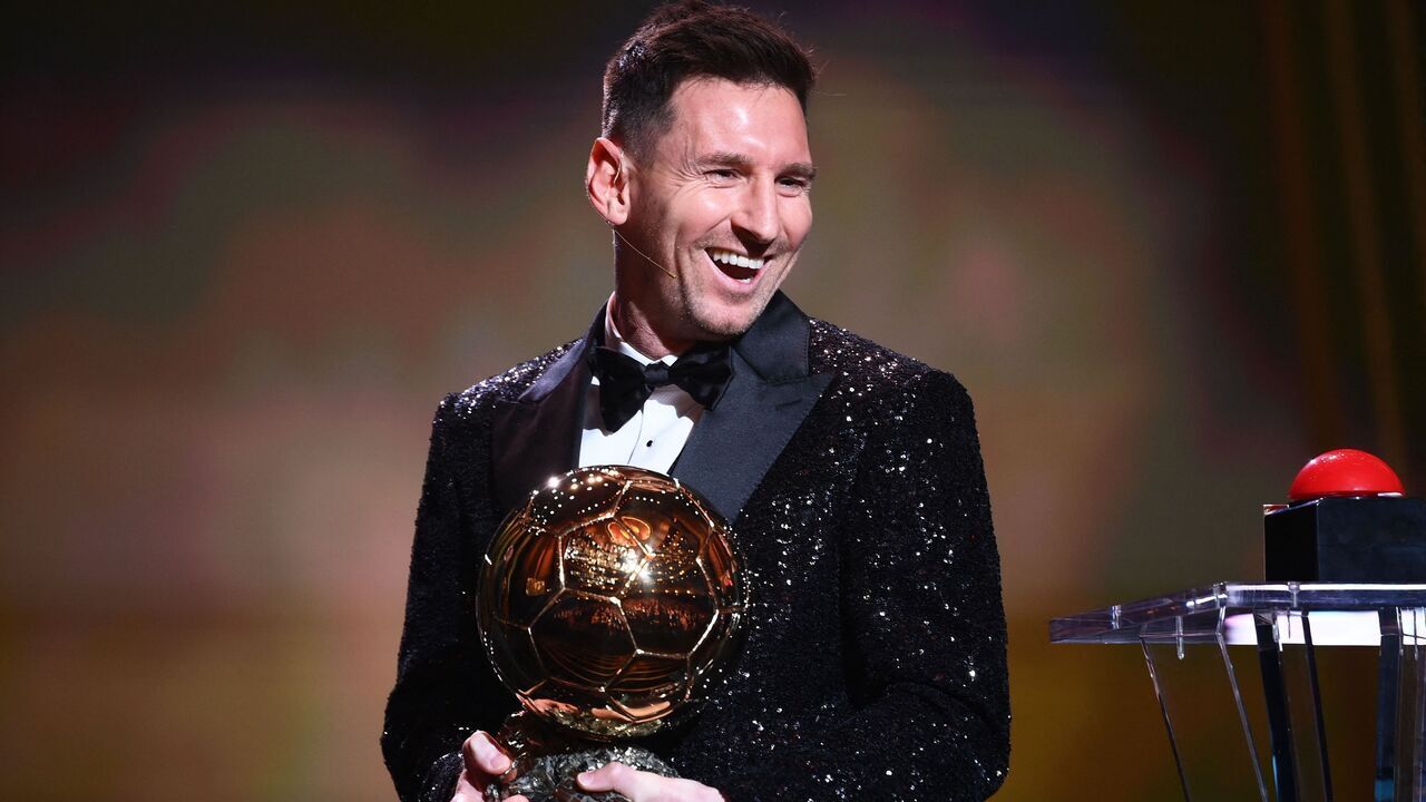 Paris Saint-Germain's Argentine forward Lionel Messi reacts after being awarded the the Ballon d'Or award during the 2021 Ballon d'Or France Football award ceremony at the Theatre du Chatelet in Paris on November 29, 2021.