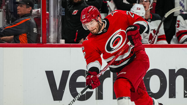 RALEIGH, NORTH CAROLINA - MAY 11: Brett Pesce #22 of the Carolina Hurricanes shoots the puck during the first period against the New Jersey Devils in Game Five of the Second Round of the 2023 Stanley Cup Playoffs at PNC Arena on May 11, 2023 in Raleigh, North Carolina.