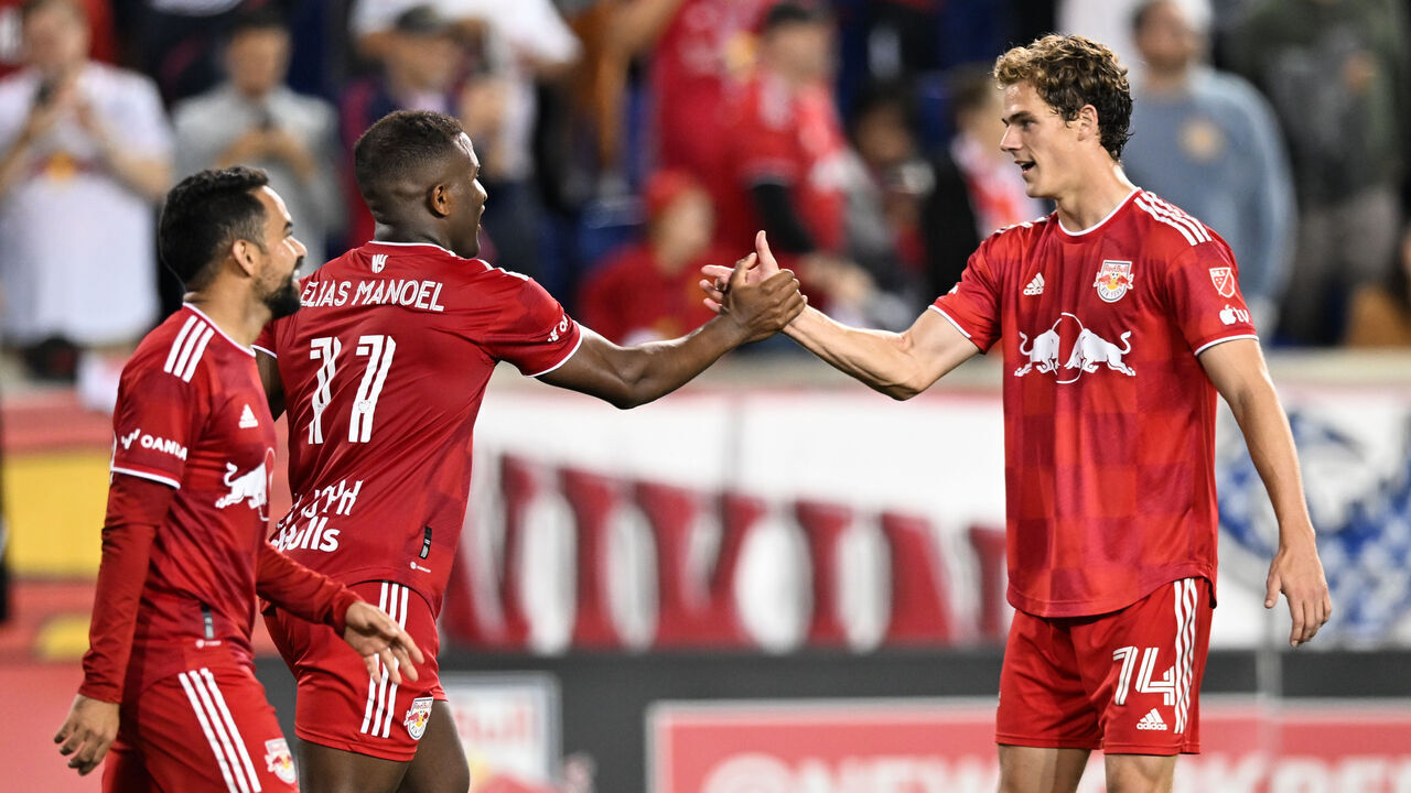 HARRISON, NEW JERSEY - OCTOBER 25: Elias Manoel #11 and Tom Barlow #74 of the New York Red Bulls celebrate a goal during the match against Charlotte FC at Red Bull Arena on October 25, 2023 in Harrison, New Jersey.