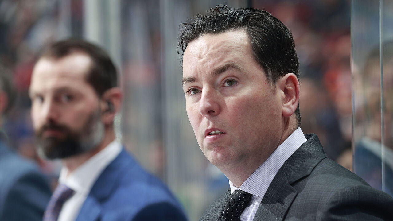 VANCOUVER, CANADA - OCTOBER 11: Head coach Jay Woodcroft of the Edmonton Oilers looks on from the bench during their NHL game against the Vancouver Canucks at Rogers Arena October 11, 2023 in Vancouver, British Columbia, Canada.