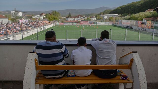 Fans watch FC Ballkani's match from a balcony in Theranda, on October 20, 2023. In Theranda, a small town in southern Kosovo, it's simple: "you get up, you eat, and you go to bed with Ballkani", the soccer club that has achieved the feat of qualifying for the Conference League not once, but twice. And they're hoping to beat Astana on October 26, 2023. Ballkani, who beat Dynamo Zagreb 2-0 in their last match, is currently 2nd in their group. If they stay there, or even come out on top, they would be the first Kosovar club to reach the knockout stages.