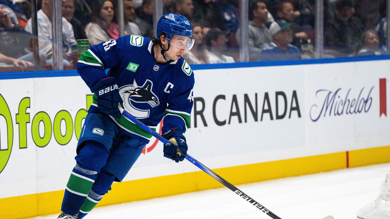 VANCOUVER, BC - OCTOBER 11:Vancouver Canucks defenseman Quinn Hughes (43) skates with the puck during the second period of an NHL game against the Edmonton Oilers on October 11, 2023, at Rogers Arena in Vancouver, B.C.