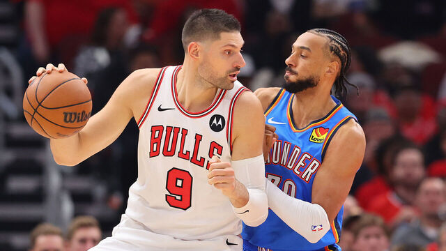 CHICAGO, ILLINOIS - OCTOBER 25: Nikola Vucevic #9 of the Chicago Bulls is defended by Olivier Sarr #30 of the Oklahoma City Thunder during the first half at the United Center on October 25, 2023 in Chicago, Illinois.
