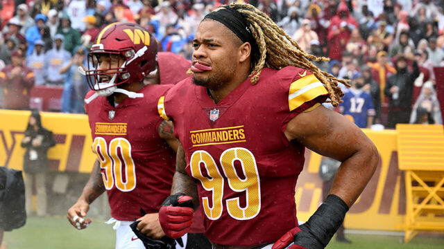 LANDOVER, MARYLAND - SEPTEMBER 24: Montez Sweat #90 and Chase Young #99 of the Washington Commanders run onto the field before the game against the Buffalo Bills at FedExField on September 24, 2023 in Landover, Maryland.