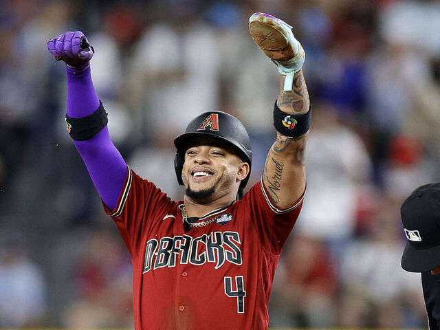 ARLINGTON, TEXAS - OCTOBER 27: Ketel Marte #4 of the Arizona Diamondbacks celebrates after stealing second base in the third inning against the Texas Rangers during Game One of the World Series at Globe Life Field on October 27, 2023 in Arlington, Texas.