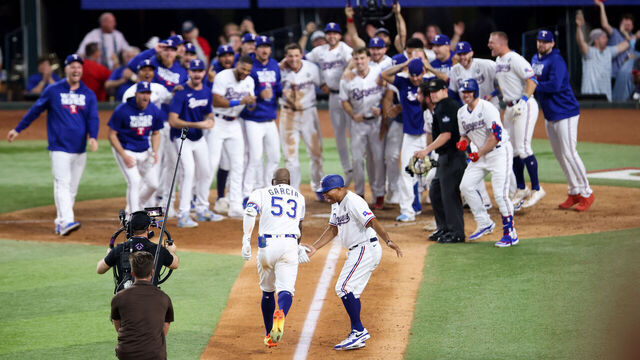 ARLINGTON, TX - OCTOBER 27: Adolis Garcia #53 of the Texas Rangers runs home after hitting a walk-off solo home run in the eleventh inning during Game 1 of the 2023 World Series between the Arizona Diamondbacks and the Texas Rangers at Globe Life Field on Friday, October 27, 2023 in Arlington, Texas.