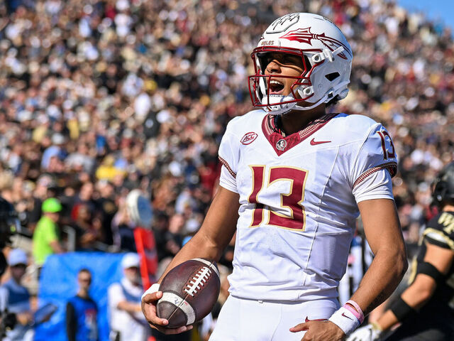 WINSTON-SALEM, NORTH CAROLINA - OCTOBER 28: Jordan Travis #13 of the Florida State Seminoles reacts after runing for a touchdown against the Wake Forest Demon Deacons during the first half of their game at Truist Field on October 28, 2023 in Winston-Salem, North Carolina.