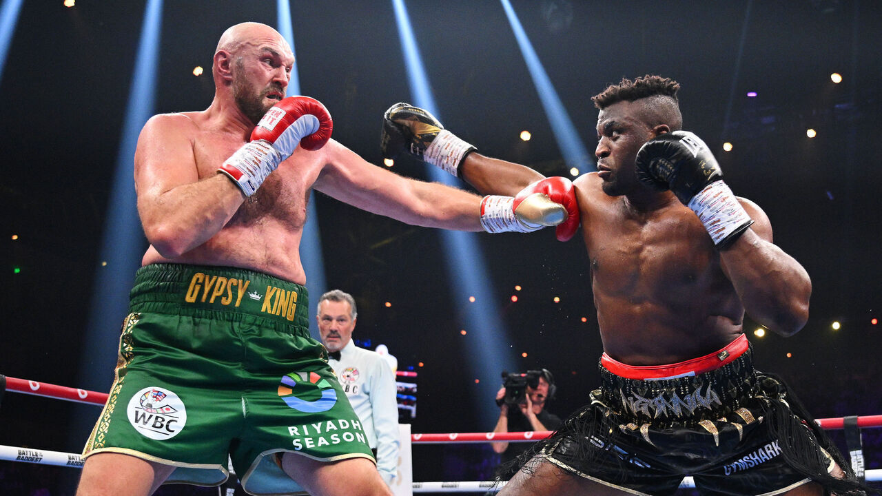 RIYADH, SAUDI ARABIA - OCTOBER 28: Tyson Fury and Francis Ngannou exchange punches during the Heavyweight fight between Tyson Fury and Francis Ngannou at Boulevard Hall on October 28, 2023 in Riyadh, Saudi Arabia.
