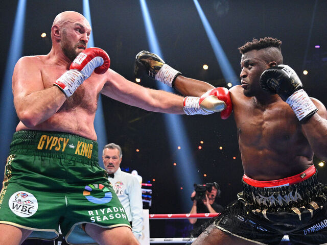RIYADH, SAUDI ARABIA - OCTOBER 28: Tyson Fury and Francis Ngannou exchange punches during the Heavyweight fight between Tyson Fury and Francis Ngannou at Boulevard Hall on October 28, 2023 in Riyadh, Saudi Arabia.