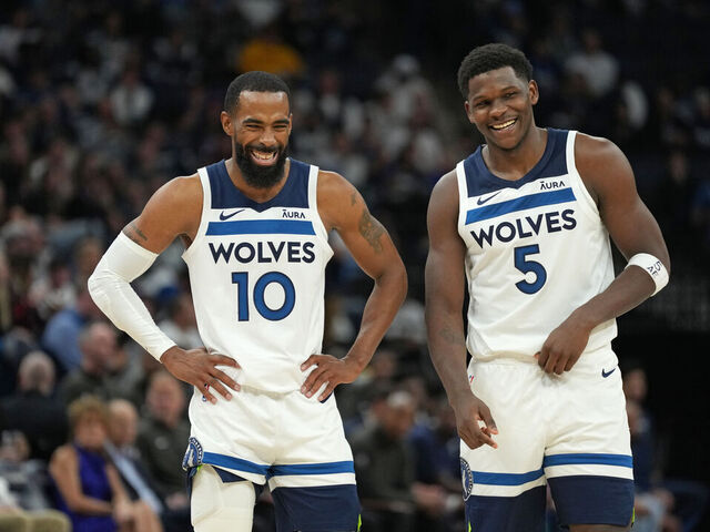 MINNEAPOLIS, MN - OCTOBER 28: Mike Conley #10 of the Minnesota Timberwolves and Anthony Edwards #5 of the Minnesota Timberwolves smile during the game against the Miami Heat on October 28, 2023 at Target Center in Minneapolis, Minnesota. Mandatory Copyright Notice: Copyright 2023 NBAE
