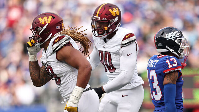 EAST RUTHERFORD, NEW JERSEY - OCTOBER 22: Chase Young #99 and Montez Sweat #90 of the Washington Commanders celebrate after a fumble recovery in the fourth quarter of the game against the New York Giants at MetLife Stadium on October 22, 2023 in East Rutherford, New Jersey.
