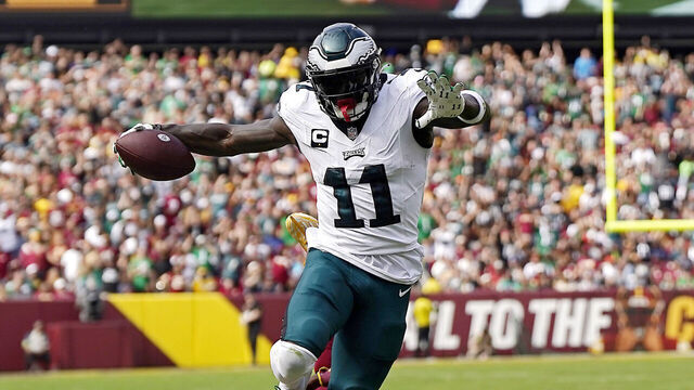 LANDOVER, MARYLAND - OCTOBER 29: Emmanuel Forbes #13 of the Washington Commanders tackles A.J. Brown #11 of the Philadelphia Eagles in the second quarter of a game at FedExField on October 29, 2023 in Landover, Maryland.