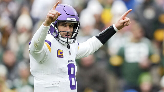 GREEN BAY, WISCONSIN - OCTOBER 29: Kirk Cousins #8 of the Minnesota Vikings reacts after throwing a pass for a touchdown during the first quarter against the Green Bay Packers at Lambeau Field on October 29, 2023 in Green Bay, Wisconsin.